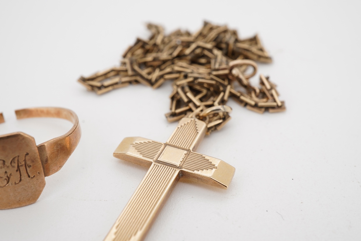 A 9ct gold cross pendant, 27mm, on a 9ct chain, 45cm and a 9ct signet ring, shank cut, 9.2 grams.